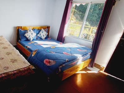 The front of Roshni Home Stay seen from the garden