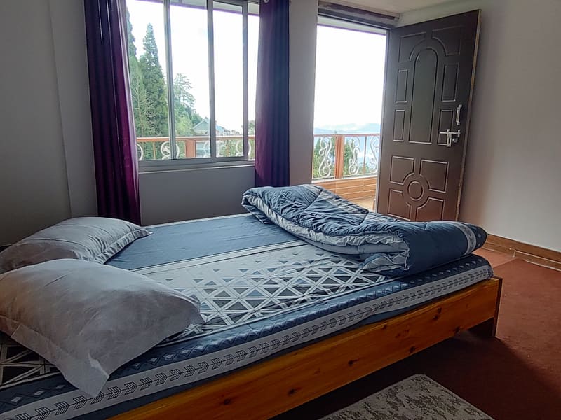 Rose room at Roshni Home Stay, with access to the shared verandah